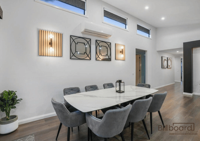 Stylish dining area with marble dining table, elegant lighting and premium interior design in a luxury Melbourne property.